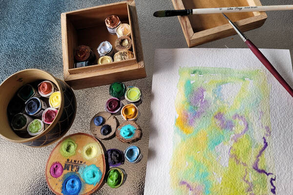 A watercolour picture and the paints used in to make the image A watercolour picture and the paints used in to make the image