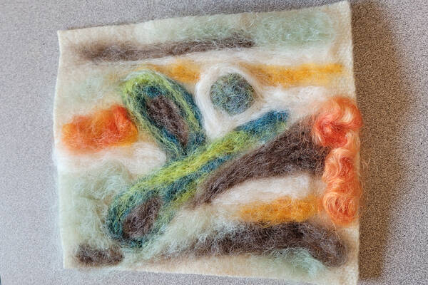 Various colours of wool felted together to make a landscape Various colours of wool felted together to make a landscape